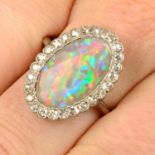 A mid 20th century platinum opal and single-cut diamond cluster ring.