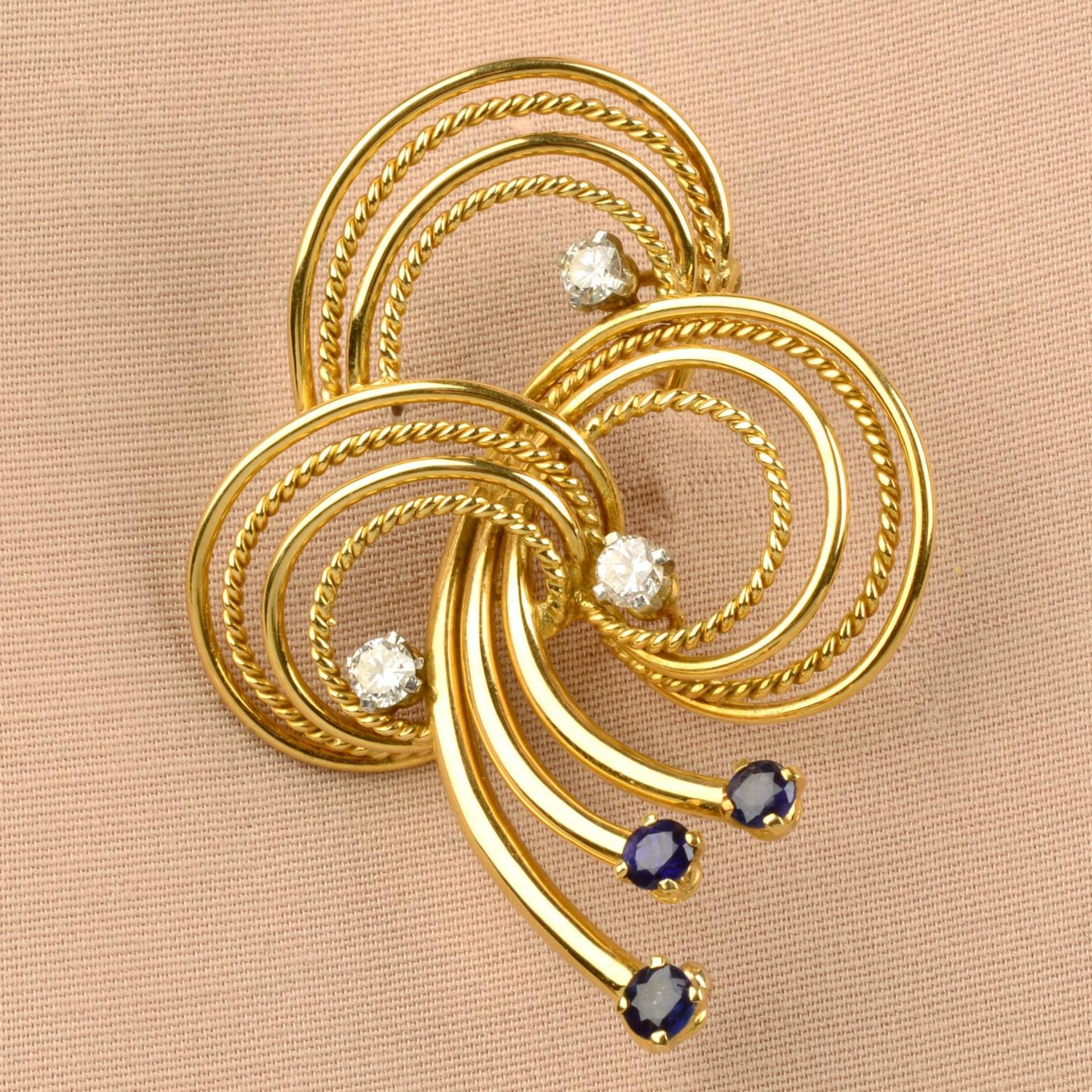 A 1950s 18ct gold sapphire and diamond rope twist brooch,
