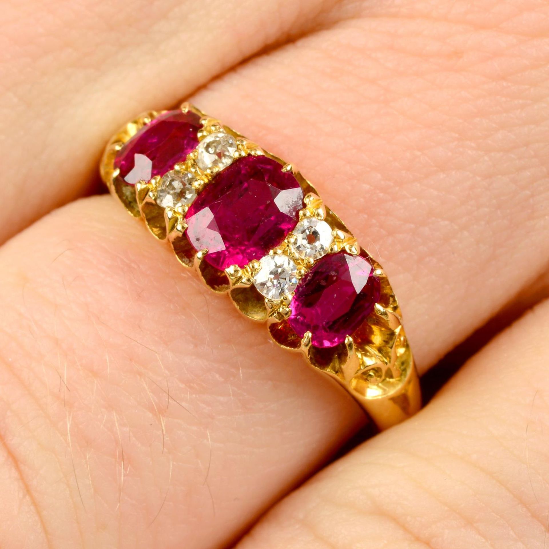 An Edwardian 18ct gold Thai ruby three-stone and diamond ring.Verbal from GCS, - Image 2 of 9