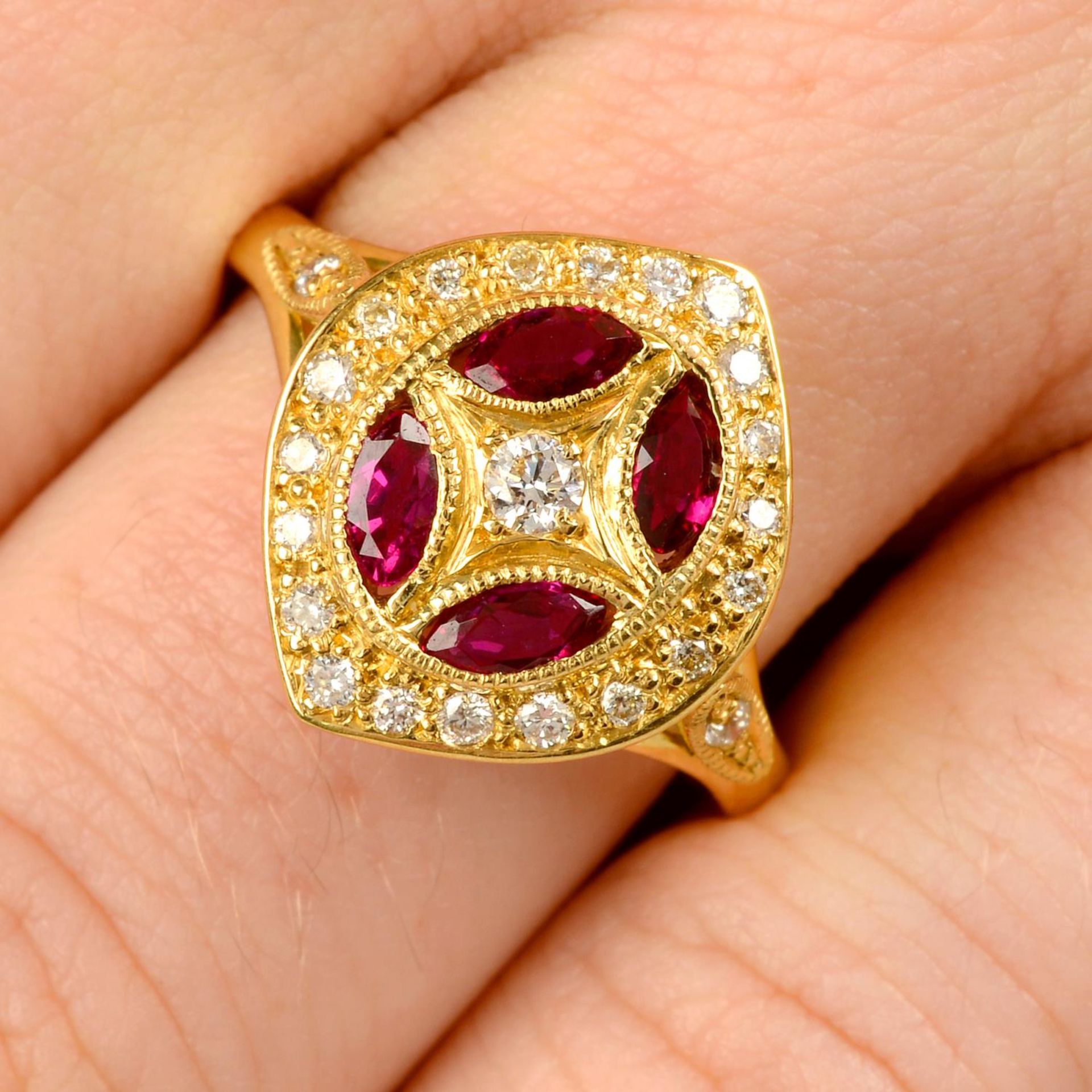 An 18ct gold ruby and diamond dress ring.