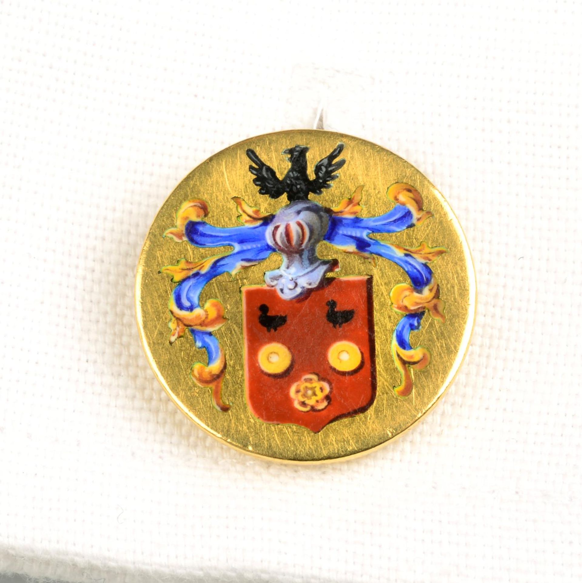 A pair of early 20th century gold enamel cufflinks, depicting a coat of arms.