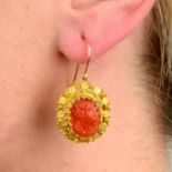 A pair of mid to late 19th century gold coral cameo earrings.Length 3.4cms.
