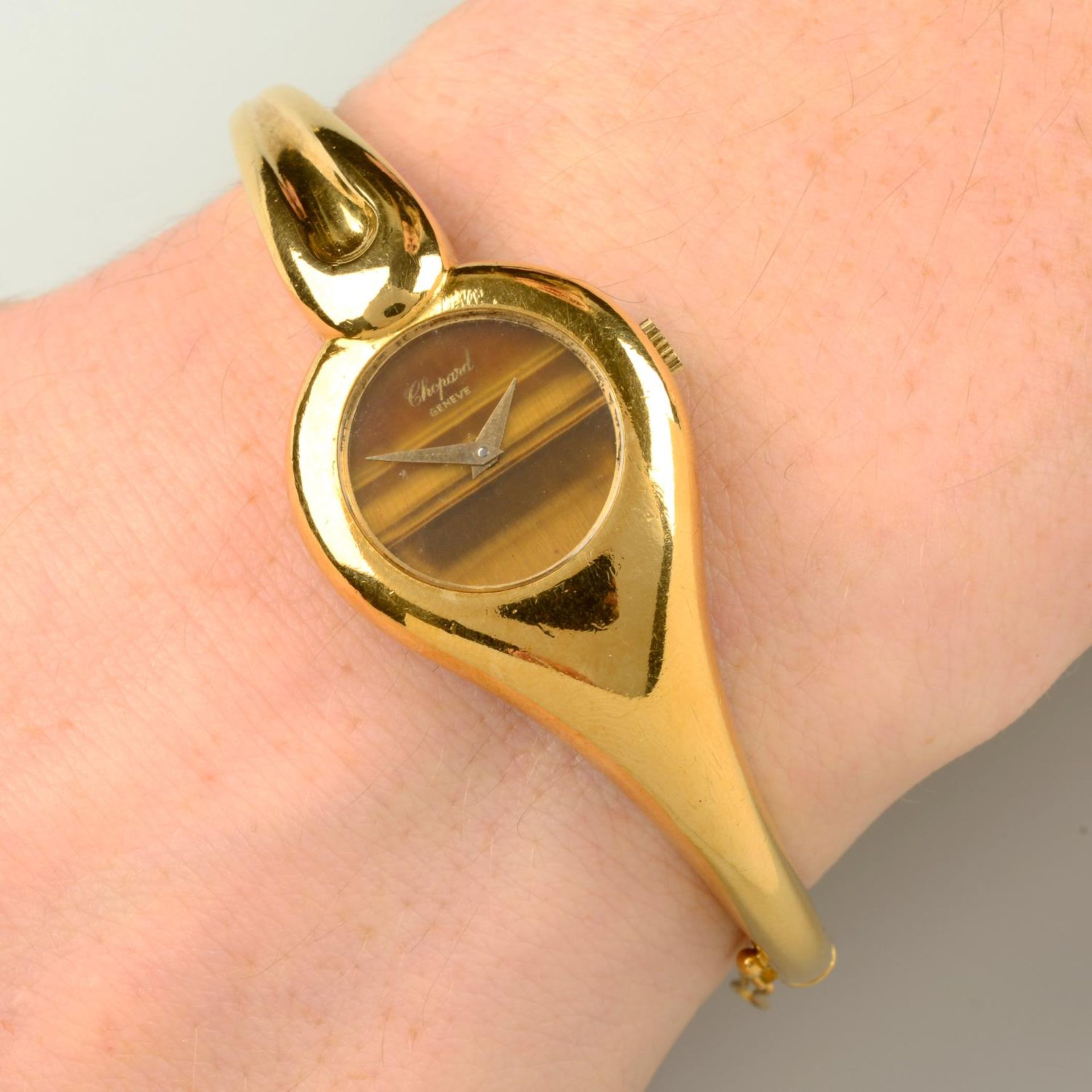 A 1970s 18ct gold bangle watch,