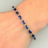 A sapphire and diamond line bracelet.