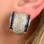 A pair of pavé-set diamond and calibré-cut sapphire hoop earrings.Estimated total diamond weight