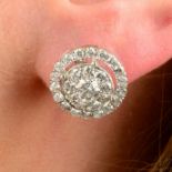 A pair of brilliant-cut diamond circular cluster earrings.Total diamond weight 2.67cts,