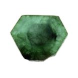 A polished hexagonal-shape emerald slice.