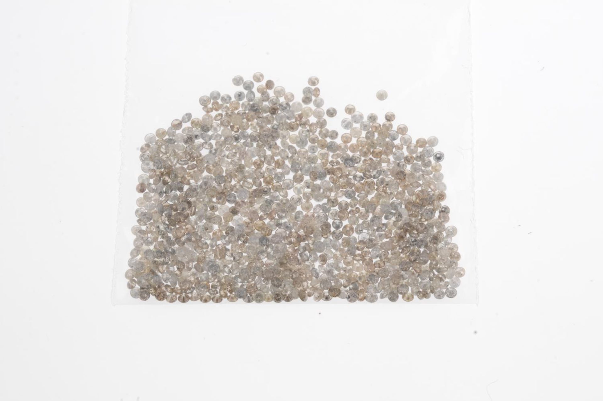 A small selection of round brilliant-cut melee diamonds and 'brown' and 'yellow' melee diamonds. - Image 2 of 2