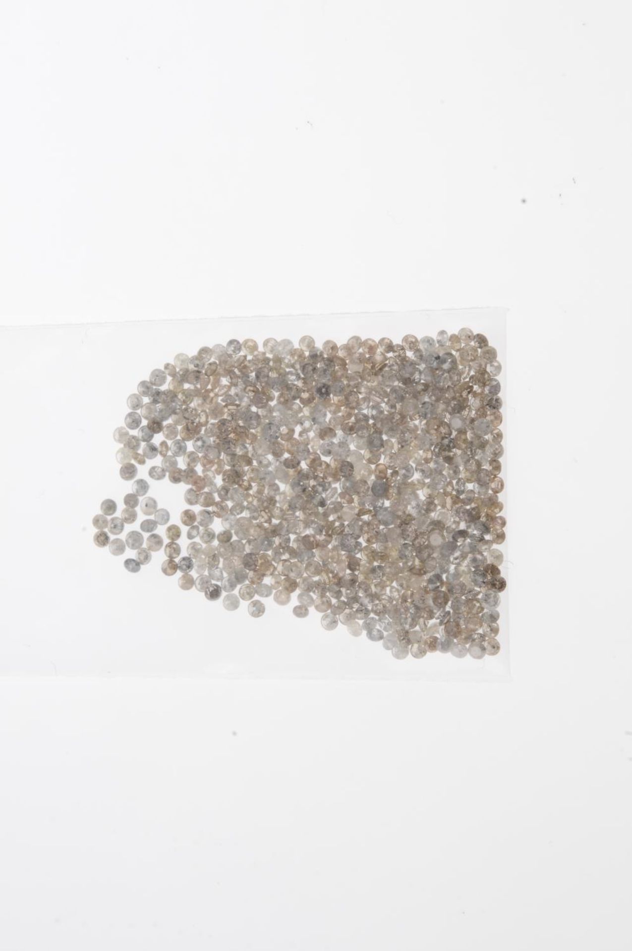 A small selection of round brilliant-cut melee diamonds and 'brown' melee diamonds. - Image 2 of 2