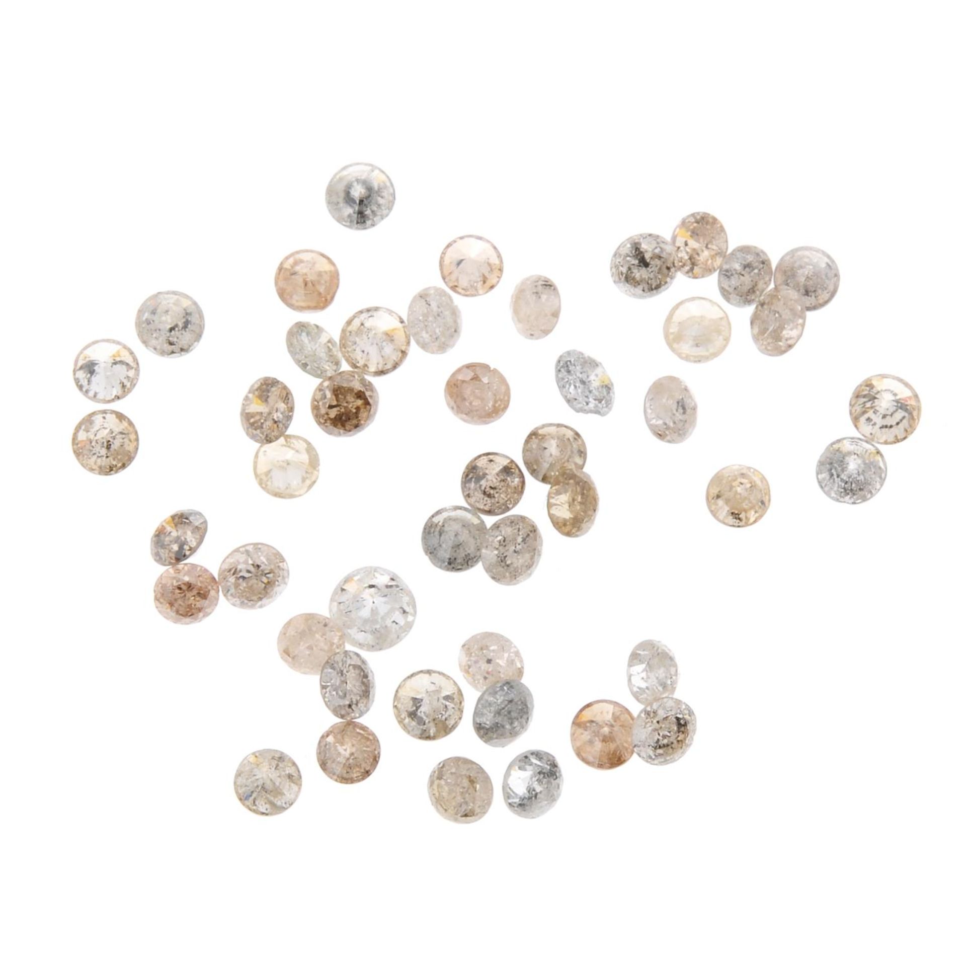 A small selection of round brilliant-cut diamonds and 'brown' melee diamonds.