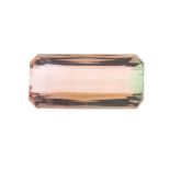 A rectangular shape bi colour tourmaline weighing 8.29ct measuring 17.75 by 8.6 by 5.5mm.