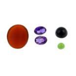 Selection of gemstones, including onyx, quartz and carved pieces.