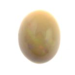 An oval opal cabochon, weighing 7.17cts.