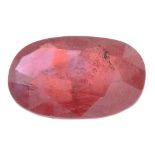 An oval-shape orange sapphire.