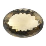 An oval shape smoky topaz weighing 81.88ct measuring 34 by 25 by 25.9mm.