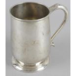 A silver mug, of typical plain form with reeded rim,