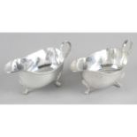 A pair of small modern silver sauce boats,