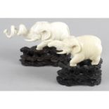 A pair of 19th century Oriental carved studies of elephants,