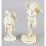 A late 19th century carved ivory okimono modelled as a mother and child, height 4 (10cm).
