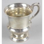 A Georgian silver christening mug of urn shape with acanthus scrolling handle.