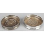 A pair of George III silver mounted coasters,