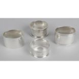 Four singular napkin rings,