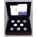 Elizabeth II, seventeen Crownsize sterling silver coins commemorating Elizabeth II's eightieth