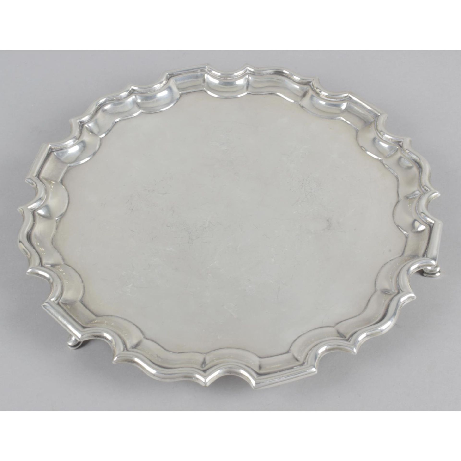 A circular silver salver,