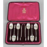 A set of late Victorian silver teaspoons with matching sugar nips,