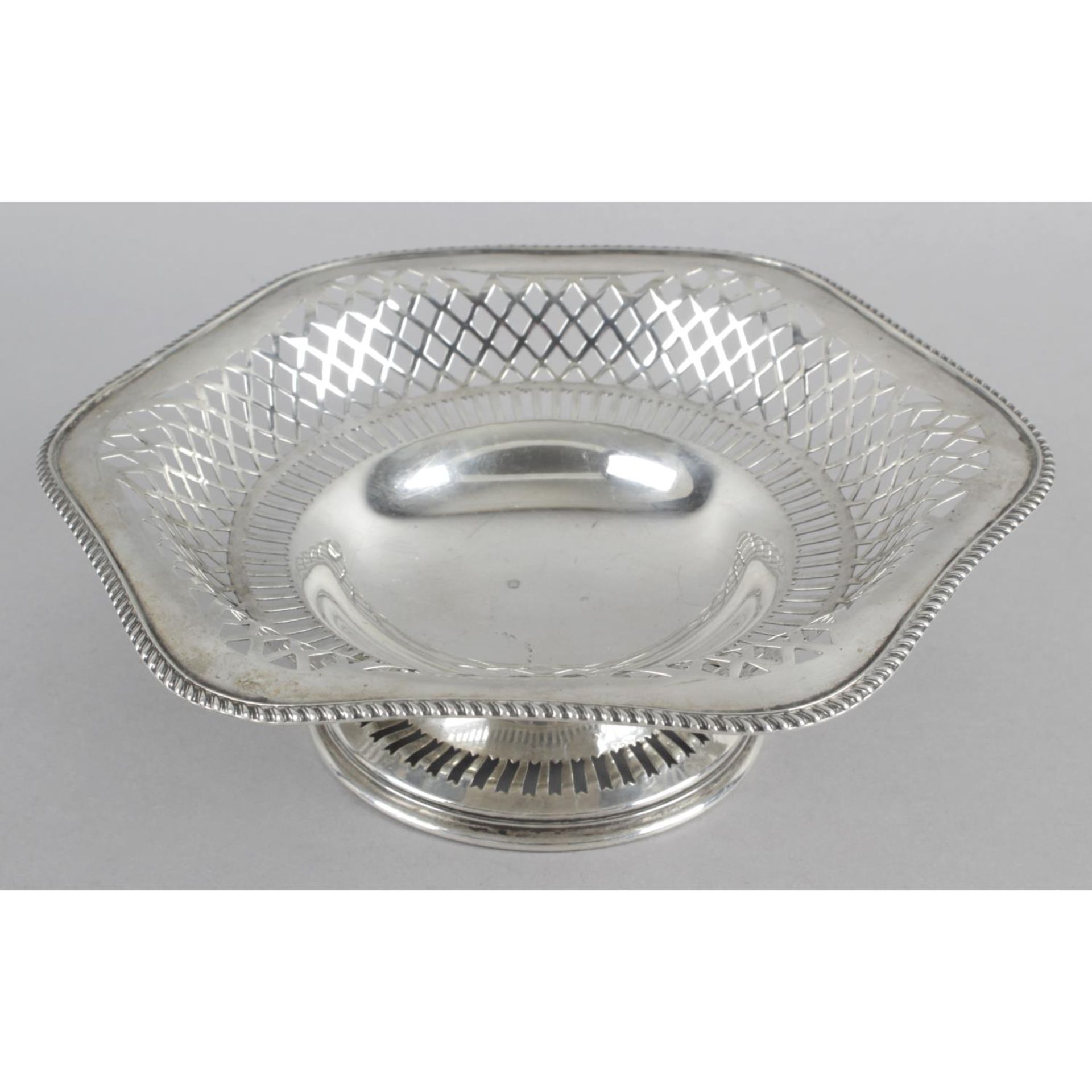 An early 20th century silver small pierced pedestal dish,