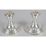 A pair of small candlesticks,