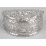 A highly decorative embossed silver trinket box,