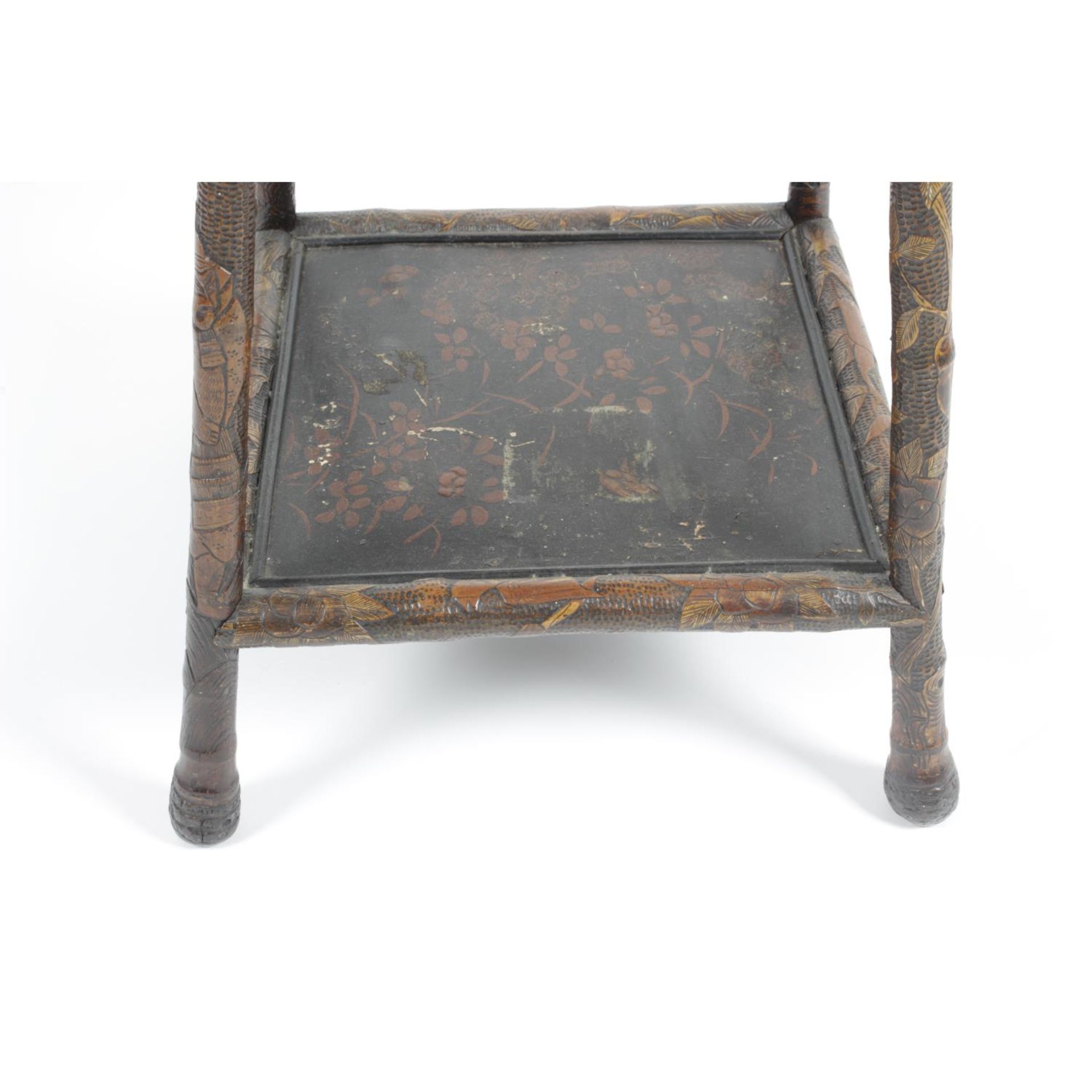 An early 20th century Oriental carved wooden and bamboo two tier occasional table, - Image 3 of 3