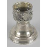 A silver and silver-gilt candle holder commemorating the restoration of York Minster,