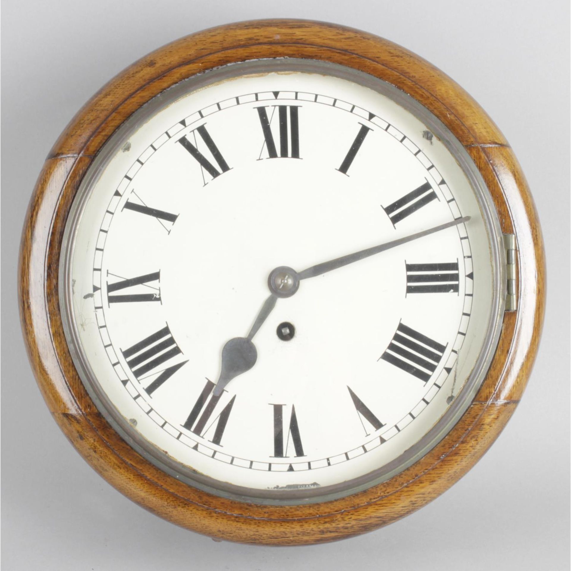 An early 20th century oak cased school-style wall clock,