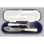 A pair of Victorian silver fish servers,