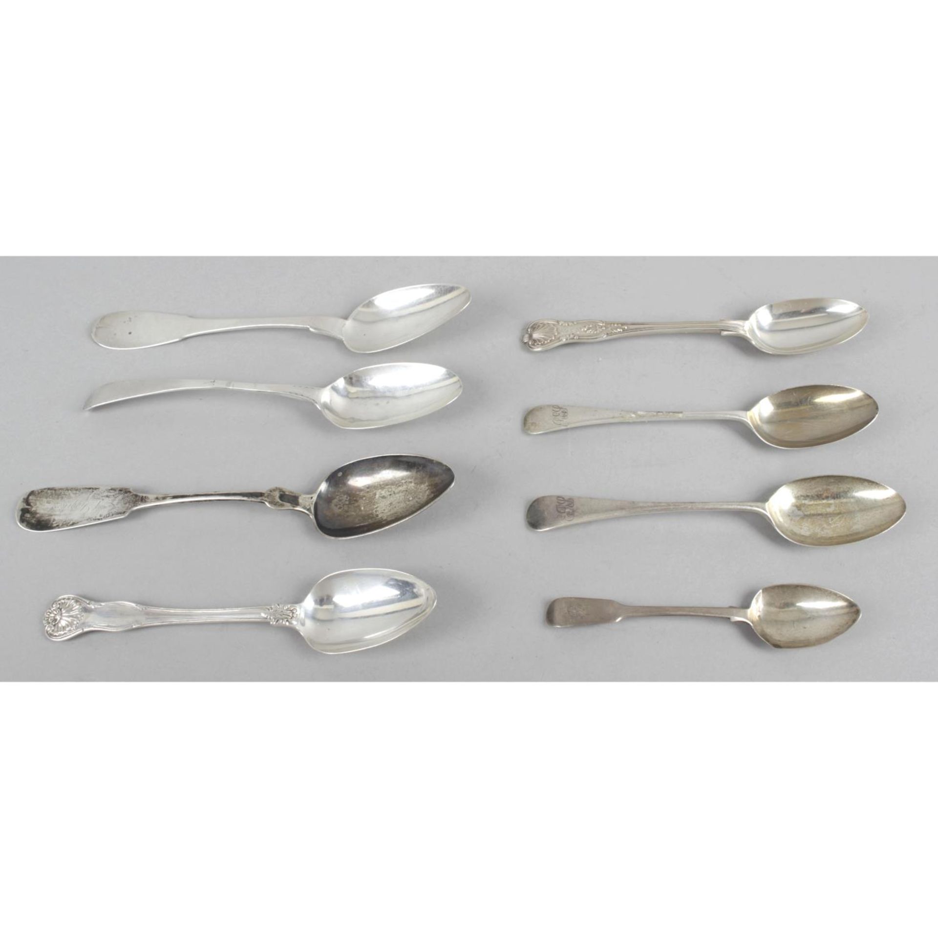 A small collection of spoons - three table spoons, four dessert spoons, and a teaspoon.