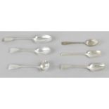 An assortment of silver spoons,