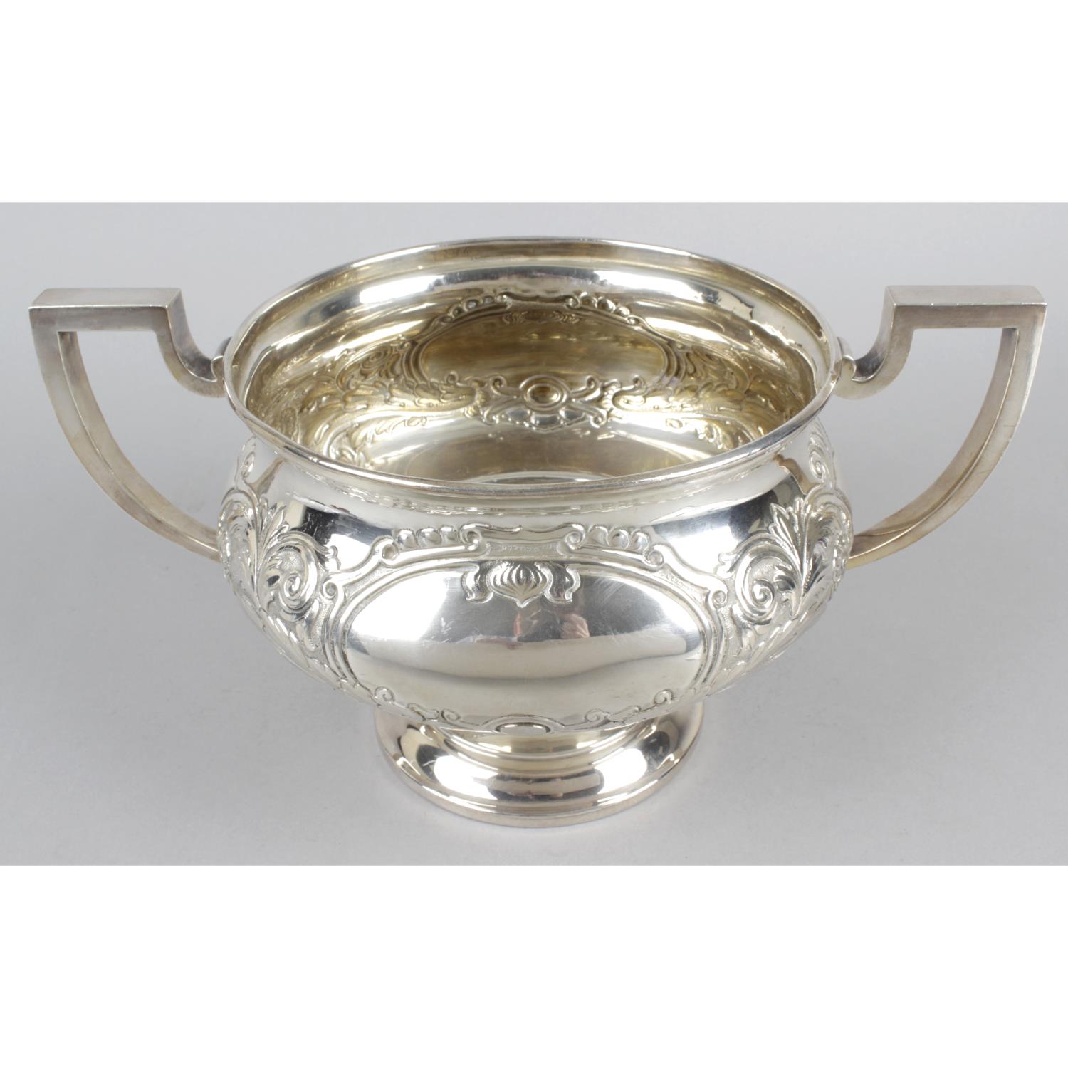 A large twin-handled pedestal bowl,