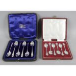 A cased set of six teaspoons and a pair of sugar tongs,