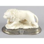An early 20th century carved ivory study of a roaring lion,