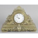 A 19th century gilt metal mantel clock of pierced design,