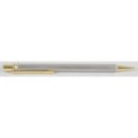 A Must de Cartier gold plated and brushed steel cased 'Stylos' ballpoint pen,