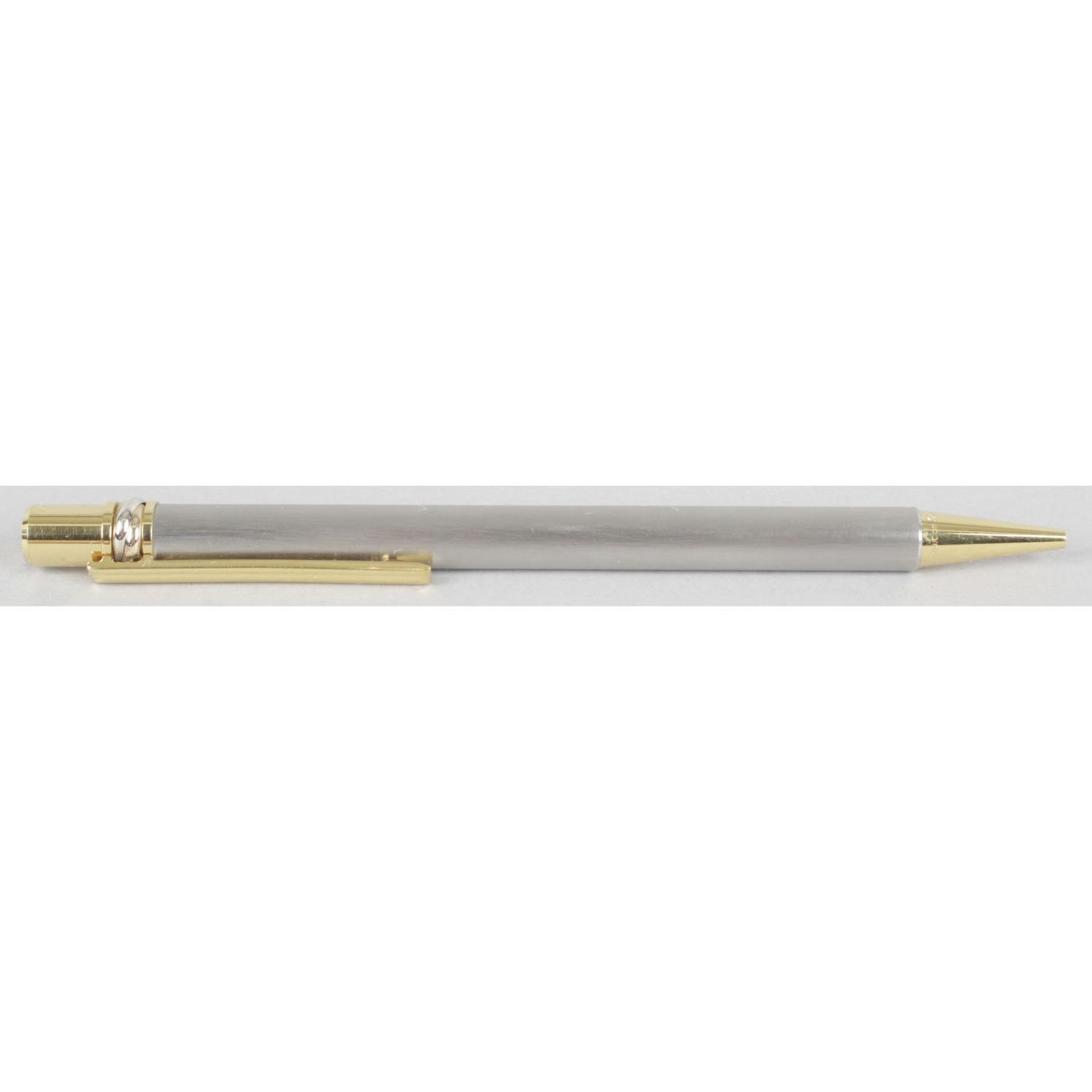 A Must de Cartier gold plated and brushed steel cased 'Stylos' ballpoint pen,