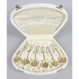 A cased set of six Norwegian silver-gilt and blue enamel coffee spoons,