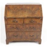 A 19th century walnut veneered bureau,