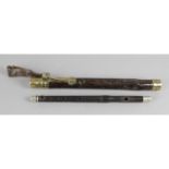 An unusual late 19th century ebony flute,
