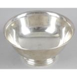 A white metal bowl and two other smaller bowls - the larger one marked on the base 'Paul Revere