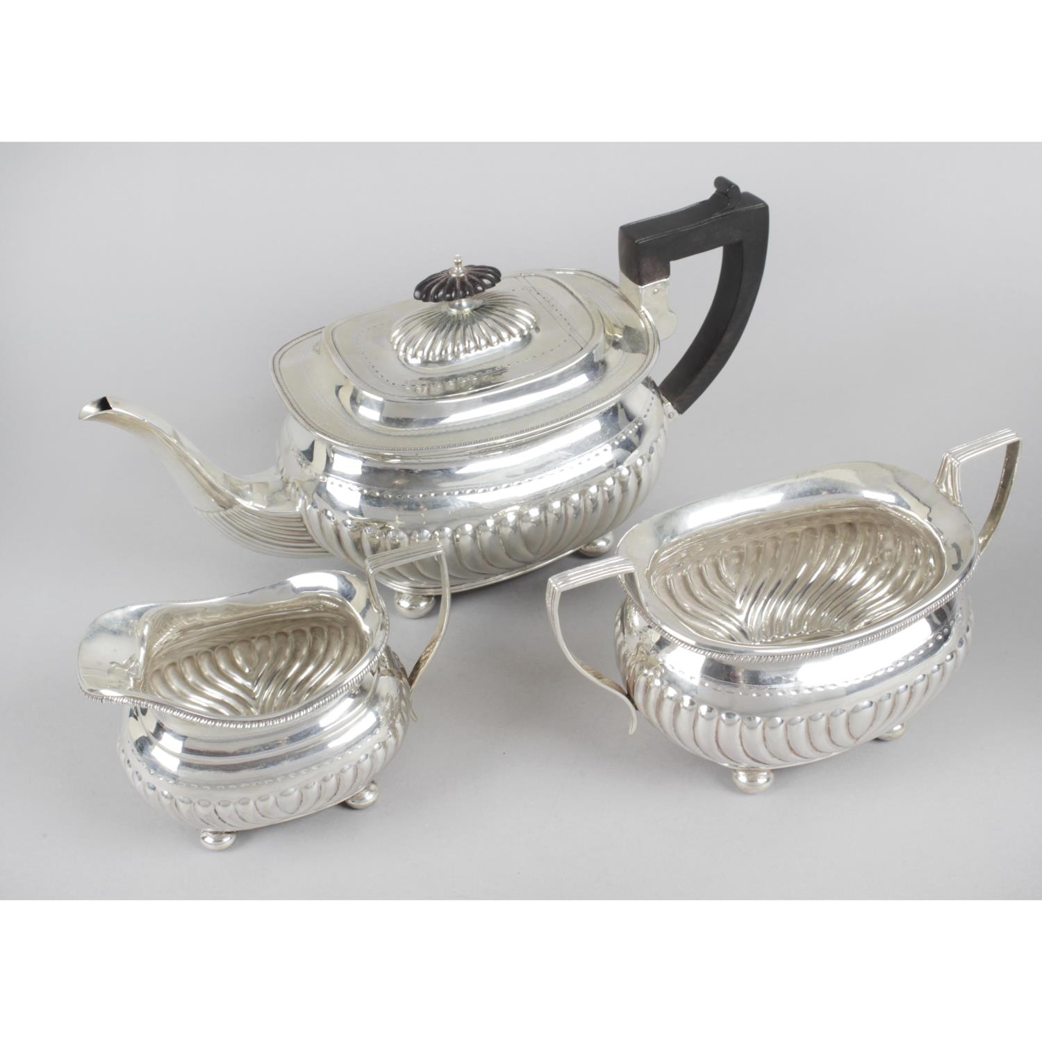 A late Victorian silver three piece tea service,