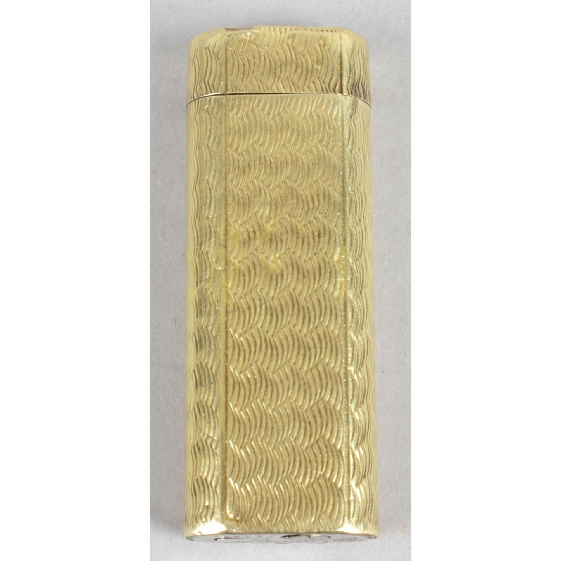 A Cartier gold plated cigarette lighter,